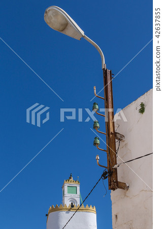 Street lamp and a tower of a mosque 42637855