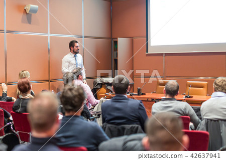 Skiled Public Speaker Giving a Talk at Business Meeting. Skiled Public Speaker Giving a Talk at Business Meeting. 42637941