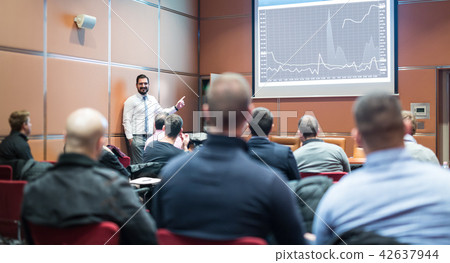 Skiled Public Speaker Giving a Talk at Business Meeting. Skiled Public Speaker Giving a Talk at Business Meeting. 42637944