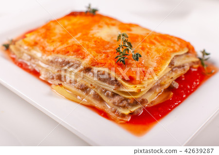 Italian Food. Hot tasty Classic Lasagna with bolognese sauce on white plate. Italian Food. Hot tasty Classic Lasagna with bolognese sauce on white plate. 42639287