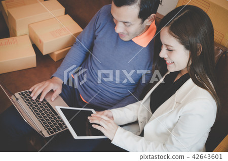 Happy Business Couple is working together at home 42643601