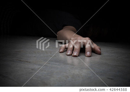 The dead woman's body. Focus on hand 42644388