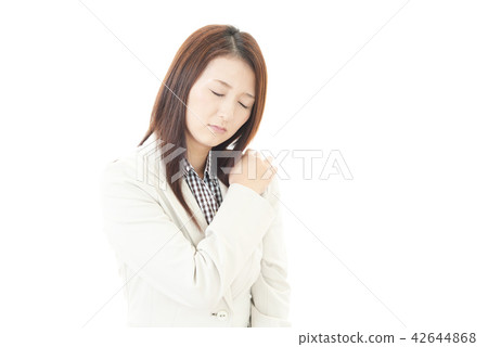 Women complaining of stiff shoulders 42644868