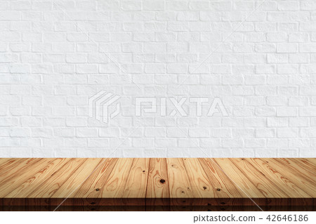 wood table with white brick wall background. wood table with white brick wall background. 42646186