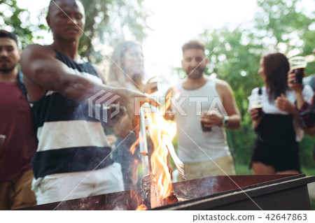 Group of friends making barbecue in the backyard. concept about good and positive mood with friends 42647863