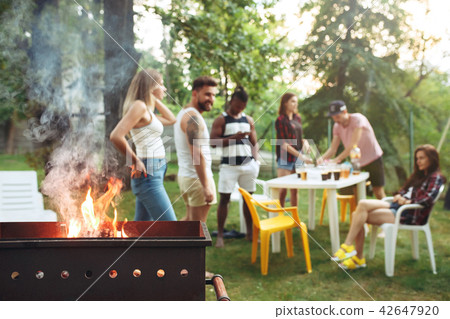 Group of friends making barbecue in the backyard. concept about good and positive mood with friends 42647920