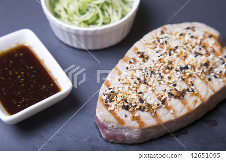 Grilled tuna with sesame and cucumber salad 42651095