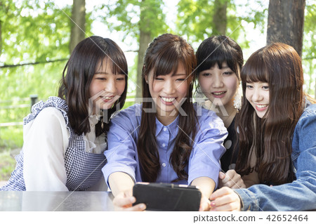 A group of women taking self-taking A group of women taking self-taking 42652464