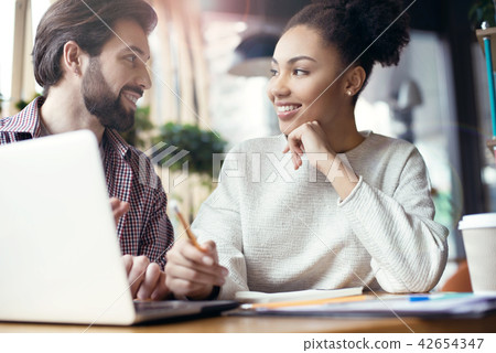 Young people coworking together at creative office sitting looki 42654347