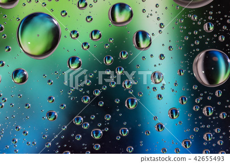 Close up Water drops on glass, green background, Close up Water drops on glass, green background, 42655493