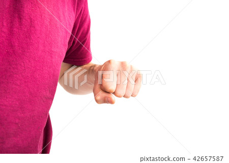 Man in t-shirt with clenched fist 42657587