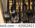 Spoons and forks made of black plastic. in Store 42662821
