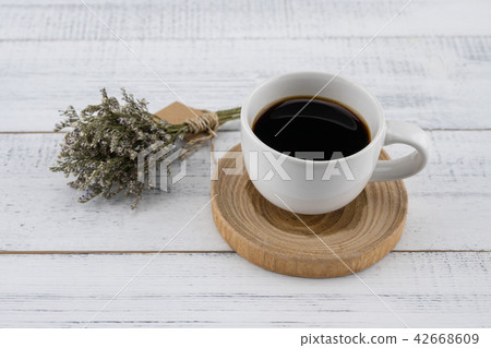 A cup of coffee with caspia bouquet A cup of coffee with caspia bouquet 42668609