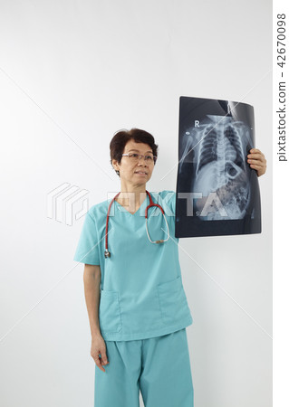 Doctors examining x-ray of chest Doctors examining x-ray of chest 42670098