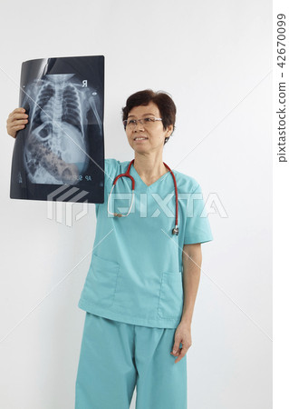 Doctors examining x-ray of chest Doctors examining x-ray of chest 42670099