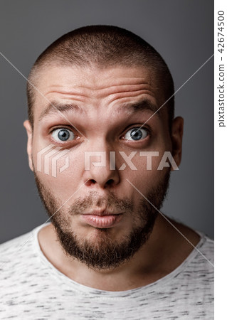 portrait of surprised young man portrait of surprised young man 42674500