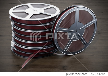 Cinema concept. Film reels on the wooden table Cinema concept. Film reels on the wooden table 42674784