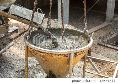 Pouring concrete into the construction of the house Pouring concrete into the construction of the house 42675211