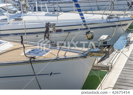 Yachts in the dock close up on sunny day Yachts in the dock close up on sunny day 42675454