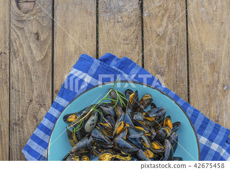 Blue plate with molds cooked in white wine Blue plate with molds cooked in white wine 42675458