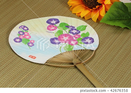 Sunflower and a fan Sunflower and a fan 42676358