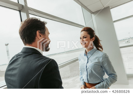 Satisfied employers talking together inside Satisfied employers talking together inside 42680826