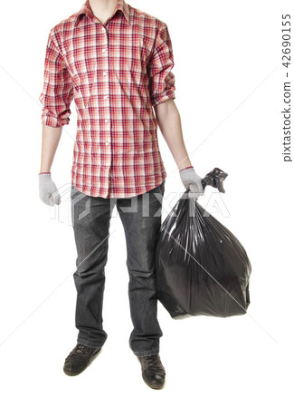 Man holding black plastic trash bag Man holding black plastic trash bag 42690155