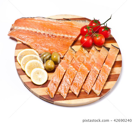 fresh red fish fillet on plate with vegetables 42690240