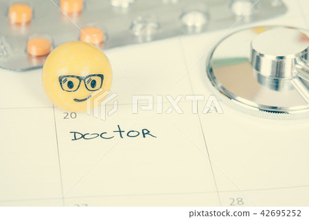 The words Doctor written on a Calendar to Remind The words Doctor written on a Calendar to Remind 42695252