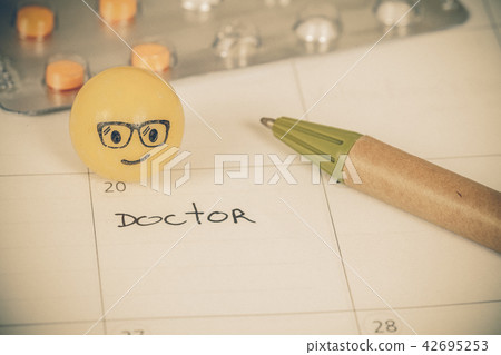 The words Doctor written on a Calendar to Remind 42695253