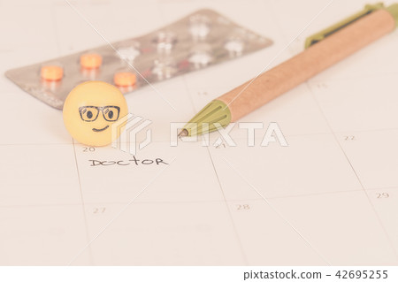 The words Doctor written on a Calendar to Remind The words Doctor written on a Calendar to Remind 42695255