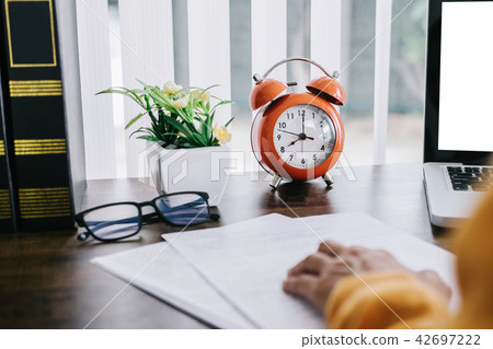 Happy casual young asian woman working in home or small office w 42697222