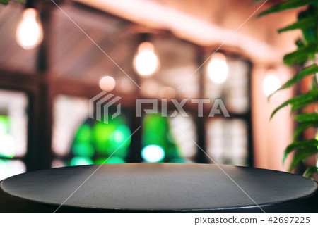 Empty wooden table and blurred background of abstract in front o 42697225