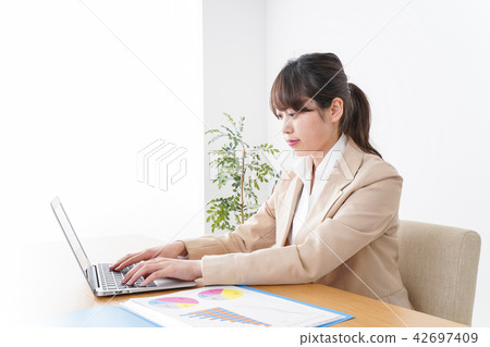 Business woman doing work 42697409