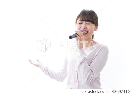 A woman singing at karaoke A woman singing at karaoke 42697410