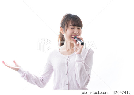 A woman singing at karaoke A woman singing at karaoke 42697412