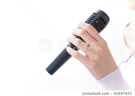 A woman singing at karaoke A woman singing at karaoke 42697422