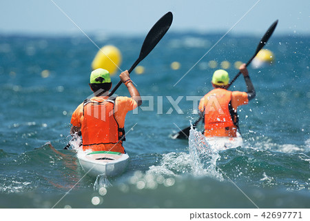Paddlers race their ocean kayak Paddlers race their ocean kayak 42697771