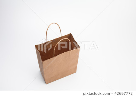 Empty Brown kraft shopping bag stand isolated on Empty Brown kraft shopping bag stand isolated on 42697772