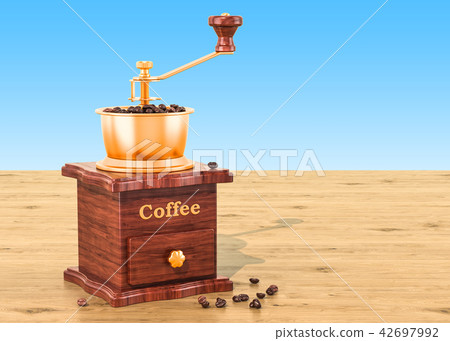 Manual coffee grinder with coffee beans 42697992