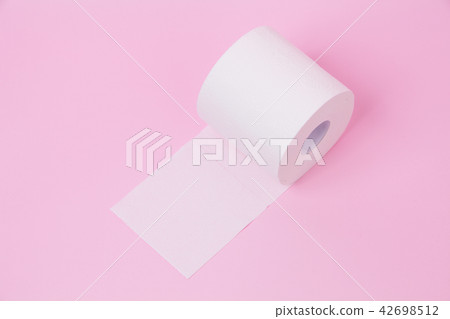 The roll of white toilet tissue paper on pink back 42698512