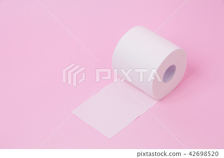 The roll of white toilet tissue paper on pink back The roll of white toilet tissue paper on pink back 42698520