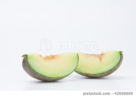 Sliced green cantaloupe melon isolated on white 42698889