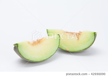 Sliced green cantaloupe melon isolated on white Sliced green cantaloupe melon isolated on white 42698890