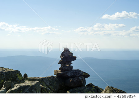 stone idol on a mountain plateau stone idol on a mountain plateau 42699854