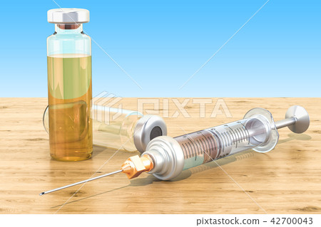 Syringe and vials on the wooden table Syringe and vials on the wooden table 42700043