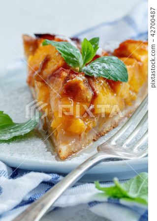 Piece of traditional Italian crostata with peaches Piece of traditional Italian crostata with peaches 42700487