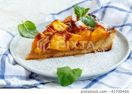 Piece of homemade peach pie. Piece of homemade peach pie. 42700488
