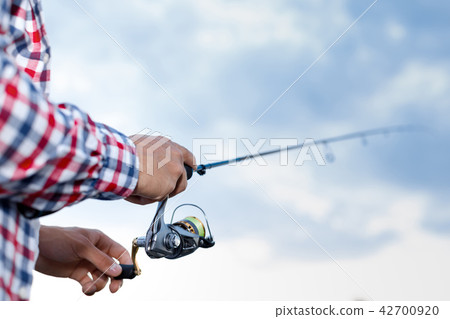 Fishing in the river at sunset. Fishing in the river at sunset. 42700920