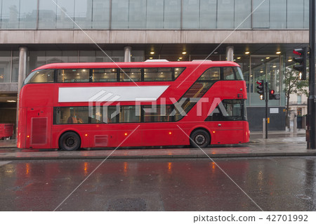 Red double decker bus on Pall Mall street 42701992